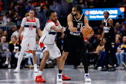 Jan 17, 2026; Denver, Colorado, USA; Denver Nuggets guard Jamal Murray (27) controls the ball as Washington Wizards guard Bub Carrington (7) guards in the fourth quarter at Ball Arena. Mandatory Credit: Isaiah J. Downing-Imagn Images