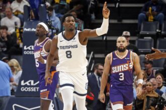 Memphis Grizzlies forward Jaren Jackson Jr. (8) reacts during the first quarter against the Phoenix Suns at FedExForum.