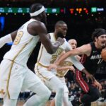 Miami Heat forward Jaime Jaquez Jr. (11) drives the ball against Boston Celtics guard Jaylen Brown (7) in the first quarter at TD Garden.