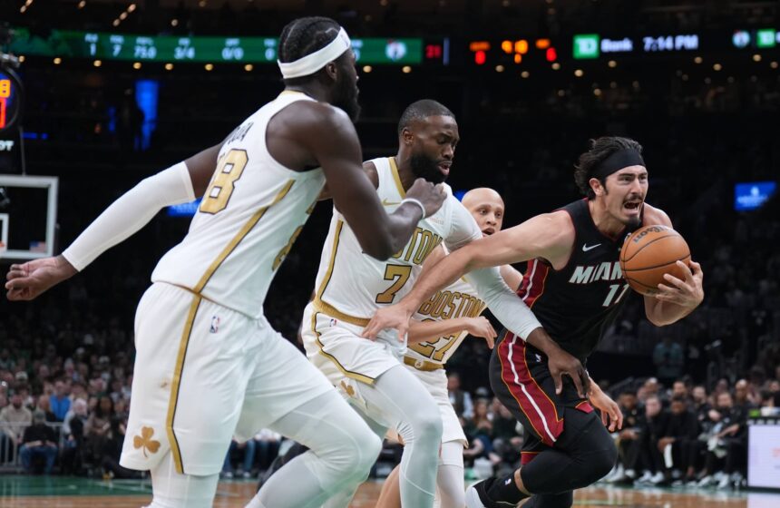 Miami Heat forward Jaime Jaquez Jr. (11) drives the ball against Boston Celtics guard Jaylen Brown (7) in the first quarter at TD Garden.
