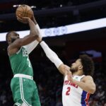 Jan 19, 2026; Detroit, Michigan, USA; Boston Celtics guard Jaylen Brown (7) shoots the ball against Detroit Pistons guard Cade Cunningham (2) in the first half at Little Caesars Arena. Mandatory Credit: Rick Osentoski-Imagn Images