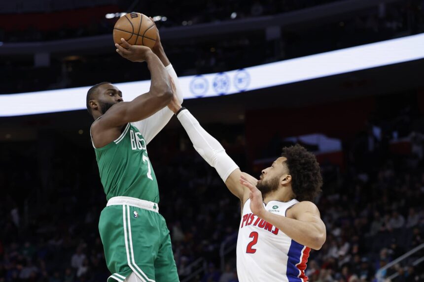 Jan 19, 2026; Detroit, Michigan, USA; Boston Celtics guard Jaylen Brown (7) shoots the ball against Detroit Pistons guard Cade Cunningham (2) in the first half at Little Caesars Arena. Mandatory Credit: Rick Osentoski-Imagn Images