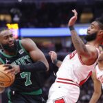 Boston Celtics guard Jaylen Brown (7) goes to the basket against Chicago Bulls guard Coby White (0) during the second half at United Center.