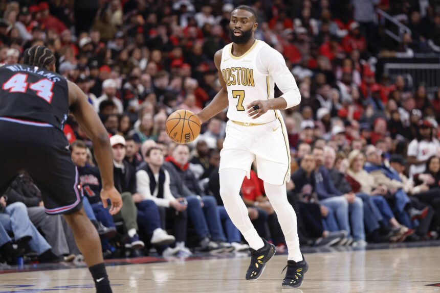 Boston Celtics guard Jaylen Brown (7) brings the ball up court against the Chicago Bulls during the second half at United Center.