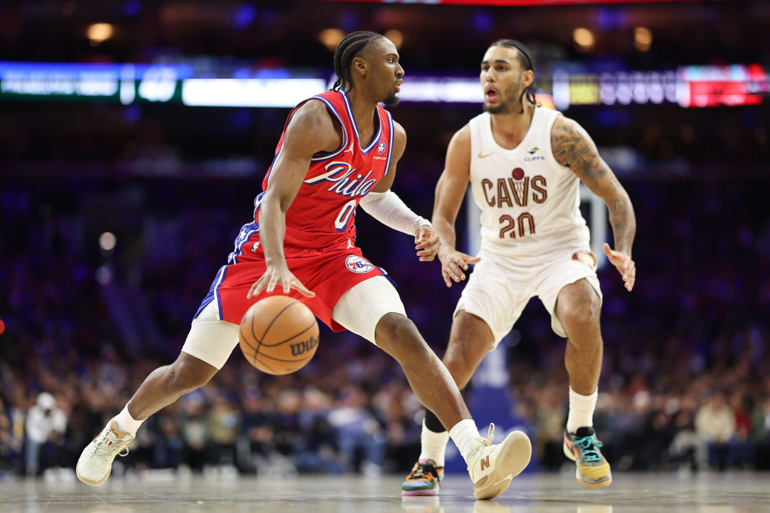 Jan 16, 2026; Philadelphia, Pennsylvania, USA; Philadelphia 76ers guard Tyrese Maxey (0) controls the ball agains Cleveland Cavaliers guard Jaylon Tyson (20) during the second quarter at Xfinity Mobile Arena. Mandatory Credit: Bill Streicher-Imagn Images
