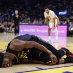 Jan 19, 2026; San Francisco, California, USA; Golden State Warriors forward Jimmy Butler III (10) holds his right knee as he goes down with an injury during the third quarter against the Miami Heat at Chase Center. Mandatory Credit: Kelley L Cox-Imagn Images