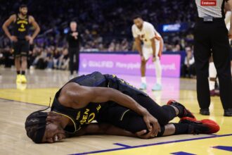 Jan 19, 2026; San Francisco, California, USA; Golden State Warriors forward Jimmy Butler III (10) holds his right knee as he goes down with an injury during the third quarter against the Miami Heat at Chase Center. Mandatory Credit: Kelley L Cox-Imagn Images