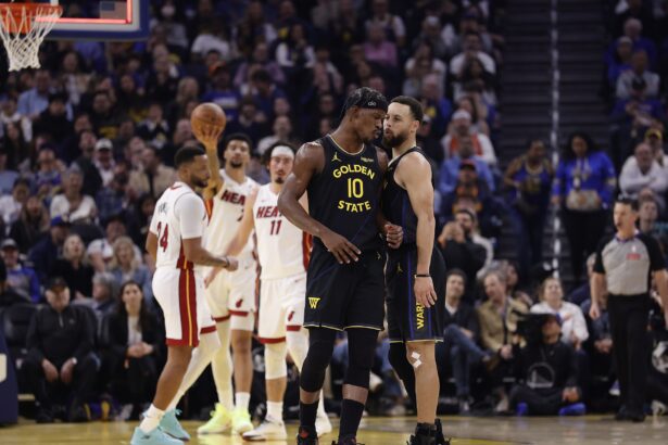 Jan 19, 2026; San Francisco, California, USA; Golden State Warriors forward Jimmy Butler III (10) and guard Stephen Curry (30) react after Butler misses a shot at the buzzer during the first quarter against the Miami Heat at Chase Center. Mandatory Credit: Kelley L Cox-Imagn Images