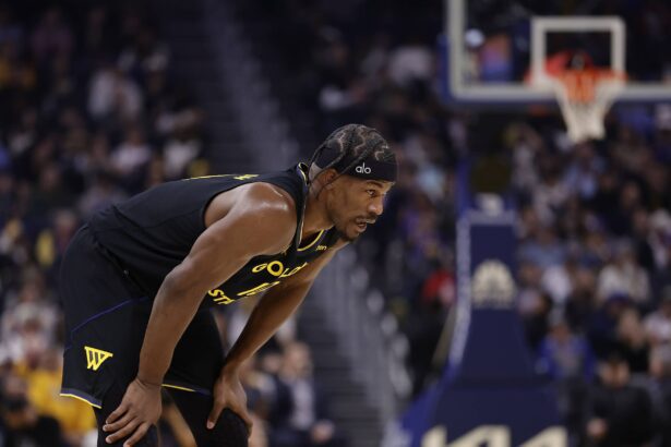 Jan 19, 2026; San Francisco, California, USA; Golden State Warriors forward Jimmy Butler III (10) between plays against the Miami Heat during the first quarter at Chase Center. Mandatory Credit: Kelley L Cox-Imagn Images