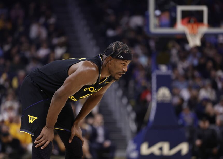 Jan 19, 2026; San Francisco, California, USA; Golden State Warriors forward Jimmy Butler III (10) between plays against the Miami Heat during the first quarter at Chase Center. Mandatory Credit: Kelley L Cox-Imagn Images