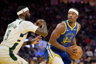 Golden State Warriors forward Jimmy Butler III (10) looks to pass the ball against Milwaukee Bucks forward Bobby Portis (9) during the third quarter at Chase Center.