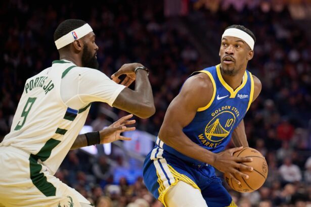 Golden State Warriors forward Jimmy Butler III (10) looks to pass the ball against Milwaukee Bucks forward Bobby Portis (9) during the third quarter at Chase Center.
