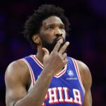 Jan 29, 2026; Philadelphia, Pennsylvania, USA; Philadelphia 76ers center Joel Embiid (21) reacts to his three pointer against the Sacramento Kings during the second quarter at Xfinity Mobile Arena. Mandatory Credit: Bill Streicher-Imagn Images
