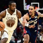 Golden State Warriors forward Jonathan Kuminga (1) drives to the basket against Cleveland Cavaliers guard Jaylon Tyson (20) during the second half at Rocket Arena.