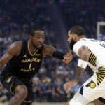 Nov 9, 2025; San Francisco, California, USA; Golden State Warriors forward Jonathan Kuminga (1) attempts to drive past Indiana Pacers forward Cody Martin (11) during the first quarter at Chase Center. Mandatory Credit: D. Ross Cameron-Imagn Images