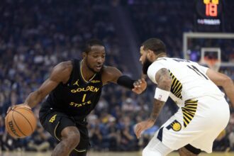 Nov 9, 2025; San Francisco, California, USA; Golden State Warriors forward Jonathan Kuminga (1) attempts to drive past Indiana Pacers forward Cody Martin (11) during the first quarter at Chase Center. Mandatory Credit: D. Ross Cameron-Imagn Images
