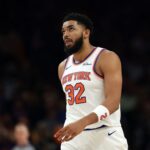 Jan 9, 2026; Phoenix, Arizona, USA; New York Knicks center Karl-Anthony Towns (32) reacts against the Phoenix Suns in the first half at Mortgage Matchup Center. Mandatory Credit: Mark J. Rebilas-Imagn Images