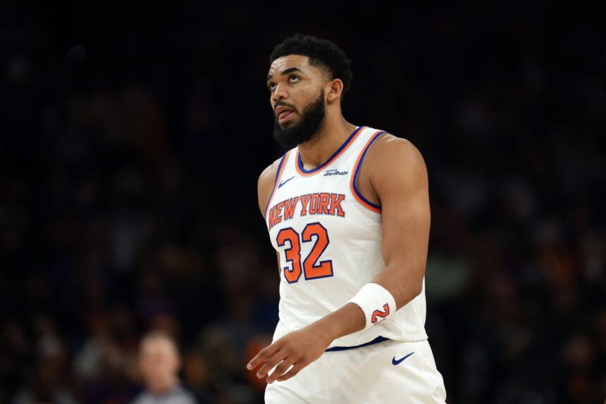 Jan 9, 2026; Phoenix, Arizona, USA; New York Knicks center Karl-Anthony Towns (32) reacts against the Phoenix Suns in the first half at Mortgage Matchup Center. Mandatory Credit: Mark J. Rebilas-Imagn Images