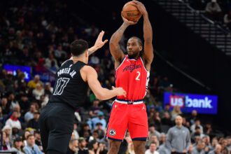 Jan 25, 2026; Inglewood, California, USA; Los Angeles Clippers forward Kawhi Leonard (2) shoots against Brooklyn Nets forward Michael Porter Jr. (17) during the first half at Intuit Dome. Mandatory Credit: Gary A. Vasquez-Imagn Images