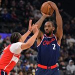 Jan 14, 2026; Inglewood, California, USA; Los Angeles Clippers forward Kawhi Leonard (2) shoots over Washington Wizards forward Kyshawn George (18) in the first half at Intuit Dome. Mandatory Credit: Jayne Kamin-Oncea-Imagn Images