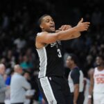 Dec 31, 2025; San Antonio, Texas, USA; San Antonio Spurs forward Keldon Johnson (3) celebrates in the second half against the New York Knicks at Frost Bank Center. Mandatory Credit: Daniel Dunn-Imagn Images