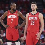 Oct 24, 2025; Houston, Texas, USA; Houston Rockets forward Kevin Durant (7) talks with center Alperen Sengun (28) during the first quarter against the Detroit Pistons at Toyota Center. Mandatory Credit: Troy Taormina-Imagn Images