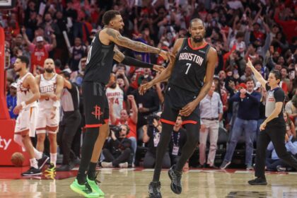 Jan 5, 2026; Houston, Texas, USA; Houston Rockets forward Jabari Smith Jr. (10) celebrates forward Kevin Durant (7) three point winning basket against the Phoenix Suns in the fourth quarter at Toyota Center. Mandatory Credit: Thomas Shea-Imagn Images