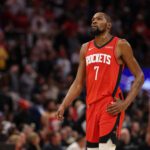 Jan 20, 2026; Houston, Texas, USA; Houston Rockets forward Kevin Durant (7) looks up at the replay board while playing against the San Antonio Spurs timeout in the second half at Toyota Center. Mandatory Credit: Thomas Shea-Imagn Images