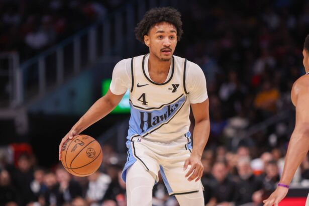 Atlanta Hawks guard Kobe Bufkin (4) dribbles against the Dallas Mavericks in the fourth quarter at State Farm Arena.