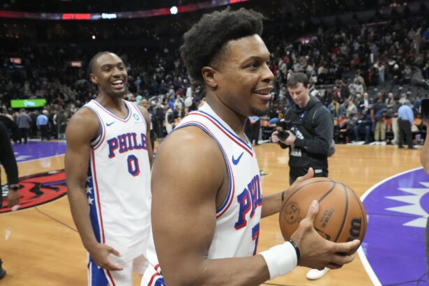 Jan 12, 2026; Toronto, Ontario, CAN; Philadelphia 76ers guard Kyle Lowry (7) and guard Tyrese Maxey (0) smile as they leave the court after a win over the Toronto Raptors at Scotiabank Arena. Mandatory Credit: John E. Sokolowski-Imagn Images