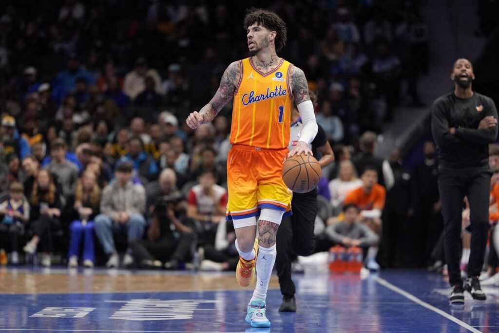 Dec 31, 2025; Charlotte, North Carolina, USA; Charlotte Hornets guard Lamelo Ball (1) brings the ball up court against the Golden State Warriors during the first quarter at Spectrum Center. Mandatory Credit: Jim Dedmon-Imagn Images