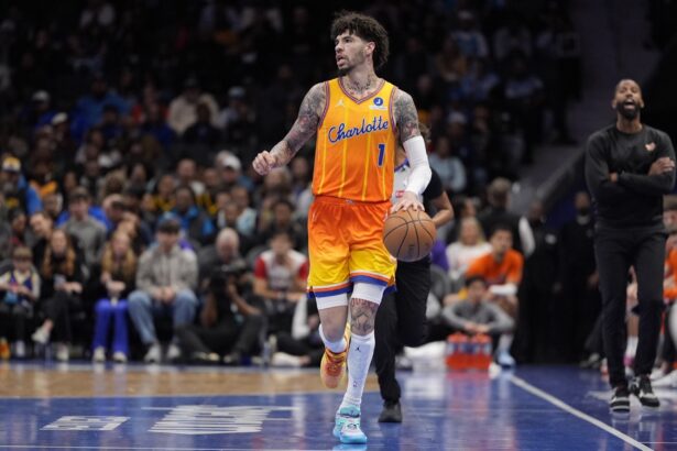Dec 31, 2025; Charlotte, North Carolina, USA; Charlotte Hornets guard Lamelo Ball (1) brings the ball up court against the Golden State Warriors during the first quarter at Spectrum Center. Mandatory Credit: Jim Dedmon-Imagn Images
