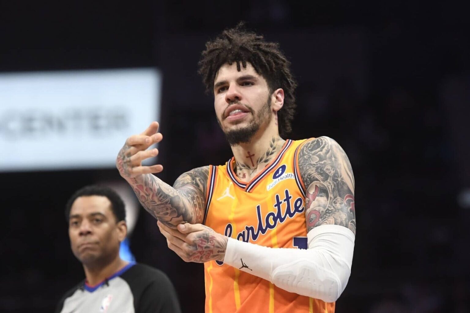 Dec 18, 2025; Charlotte, North Carolina, USA; Charlotte Hornets guard LaMelo Ball (1) rubs his elbow after falling during the second half against the Atlanta Hawks at the Spectrum Center. Mandatory Credit: Sam Sharpe-Imagn