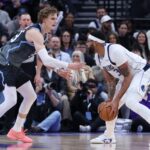 Jan 8, 2026; Salt Lake City, Utah, USA; Dallas Mavericks forward Anthony Davis (3) looks to drive against Utah Jazz forward Lauri Markkanen (23) during the second half at Delta Center. Mandatory Credit: Rob Gray-Imagn Images