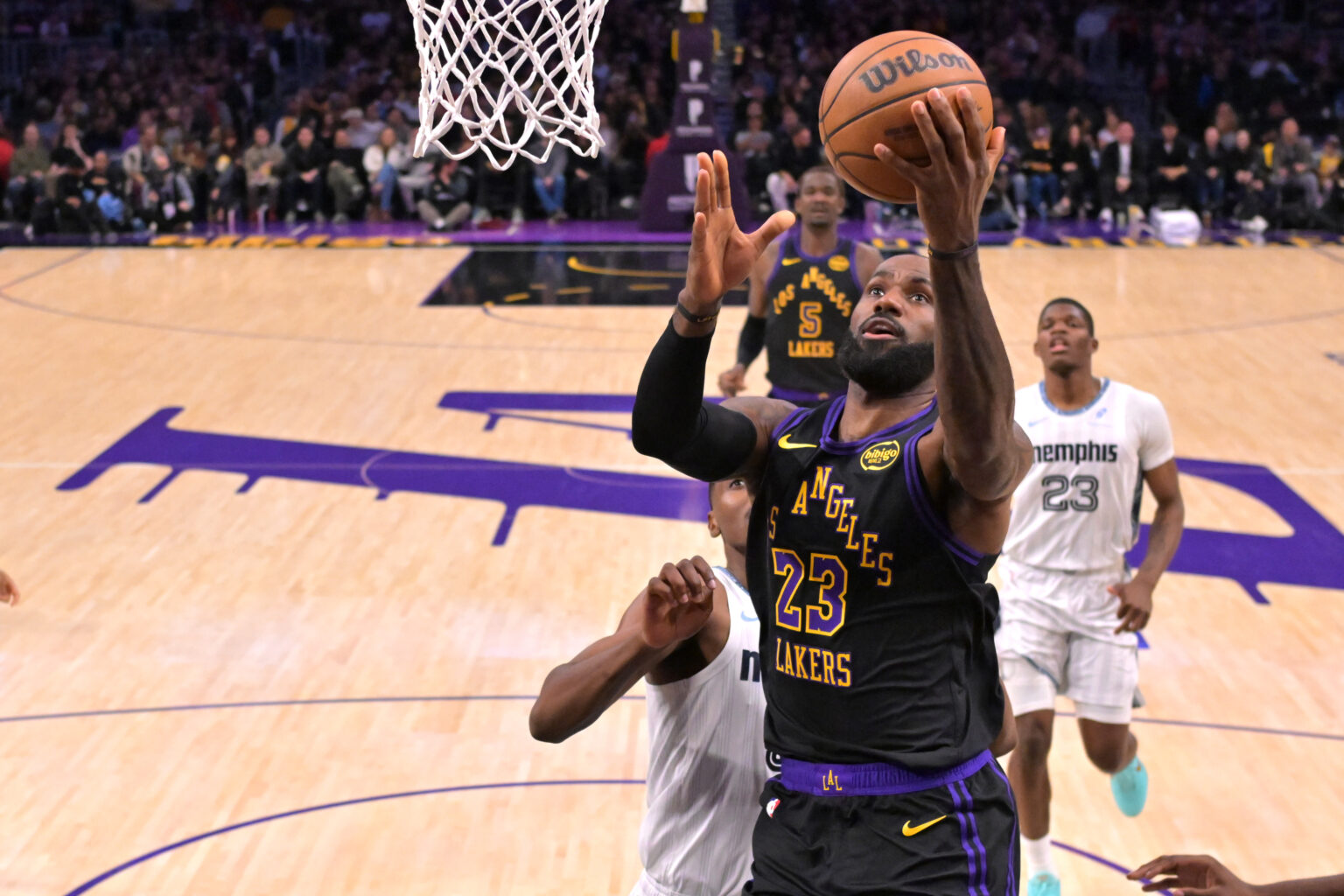 Jan 2, 2026; Los Angeles, California, USA; Los Angeles Lakers forward Lebron James (23) drives for a basket during the first half against the Memphis Grizzlies at Crypto.com Arena. Mandatory Credit: Jayne Kamin-Oncea-Imagn Images