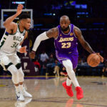 Jan 9, 2026; Los Angeles, California, USA; Los Angeles Lakers forward LeBron James (23) moves the ball against Milwaukee Bucks forward Giannis Antetokounmpo (34) during the second half at Crypto.com Arena. Mandatory Credit: Gary A. Vasquez-Imagn Images