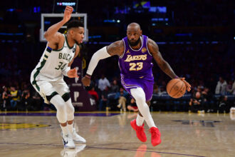 Jan 9, 2026; Los Angeles, California, USA; Los Angeles Lakers forward LeBron James (23) moves the ball against Milwaukee Bucks forward Giannis Antetokounmpo (34) during the second half at Crypto.com Arena. Mandatory Credit: Gary A. Vasquez-Imagn Images