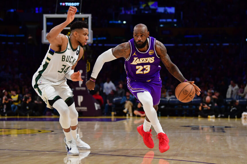 Jan 9, 2026; Los Angeles, California, USA; Los Angeles Lakers forward LeBron James (23) moves the ball against Milwaukee Bucks forward Giannis Antetokounmpo (34) during the second half at Crypto.com Arena. Mandatory Credit: Gary A. Vasquez-Imagn Images