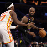 Jan 13, 2026; Los Angeles, California, USA; Los Angeles Lakers forward LeBron James (23) looks to pass the ball against Atlanta Hawks forward Onyeka Okongwu (17) during the third quarter at Crypto.com Arena. Mandatory Credit: Kiyoshi Mio-Imagn Images