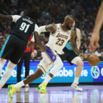 Jan 17, 2026; Portland, Oregon, USA; Los Angeles Lakers forward LeBron James (23) grabs the ball during the first half against Portland Trail Blazers guard Sidy Cissoko (91)at Moda Center. Mandatory Credit: Troy Wayrynen-Imagn Images
