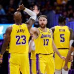 Jan 20, 2026; Denver, Colorado, USA; Los Angeles Lakers forward Drew Timme (17) reacts with forward LeBron James (23) in the second quarter against the Denver Nuggets at Ball Arena. Mandatory Credit: Isaiah J. Downing-Imagn Images