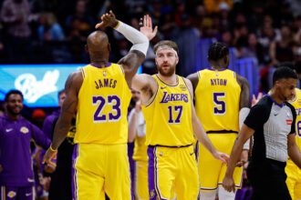 Jan 20, 2026; Denver, Colorado, USA; Los Angeles Lakers forward Drew Timme (17) reacts with forward LeBron James (23) in the second quarter against the Denver Nuggets at Ball Arena. Mandatory Credit: Isaiah J. Downing-Imagn Images