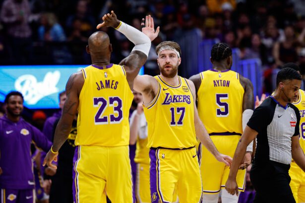 Jan 20, 2026; Denver, Colorado, USA; Los Angeles Lakers forward Drew Timme (17) reacts with forward LeBron James (23) in the second quarter against the Denver Nuggets at Ball Arena. Mandatory Credit: Isaiah J. Downing-Imagn Images