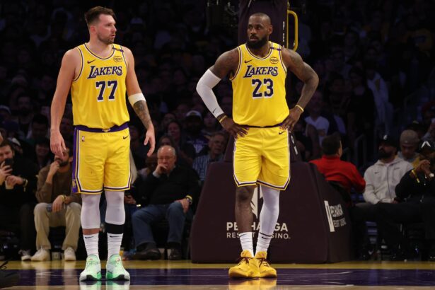 Los Angeles Lakers guard Luka Doncic (77) and forward LeBron James (23) during the second quarter against the Minnesota Timberwolves at Crypto.com Arena.
