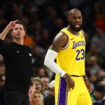 Dec 23, 2025; Phoenix, Arizona, USA; Los Angeles Lakers forward LeBron James (23) and head coach JJ Redick against the Phoenix Suns in the first half at Mortgage Matchup Center. Mandatory Credit: Mark J. Rebilas-Imagn Images