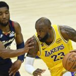 Jan 28, 2026; Cleveland, Ohio, USA; Cleveland Cavaliers guard Donovan Mitchell (45) defends Los Angeles Lakers forward LeBron James (23) in the fourth quarter at Rocket Arena. Mandatory Credit: David Richard-Imagn Images