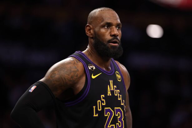 Jan 13, 2026; Los Angeles, California, USA; Los Angeles Lakers forward LeBron James (23) wears a patch affixed to the upper right chest to celebrate his record-setting 23rd NBA season during the first half against the Atlanta Hawks at Crypto.com Arena. Mandatory Credit: Kiyoshi Mio-Imagn Images