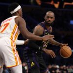 Los Angeles Lakers forward LeBron James (23) looks to pass the ball against Atlanta Hawks forward Onyeka Okongwu (17) during the third quarter at Crypto.com Arena.