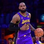 Los Angeles Lakers forward LeBron James (23) dribbles the ball against the Dallas Mavericks during the second half at Crypto.com Arena.