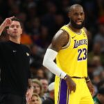 Dec 23, 2025; Phoenix, Arizona, USA; Los Angeles Lakers forward LeBron James (23) and head coach JJ Redick against the Phoenix Suns in the first half at Mortgage Matchup Center. Mandatory Credit: Mark J. Rebilas-Imagn Images